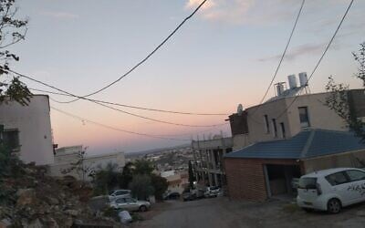 Illegal electrical cables hang over a neighborhood in Wadi Ara on November 9, 2021. (courtesy)