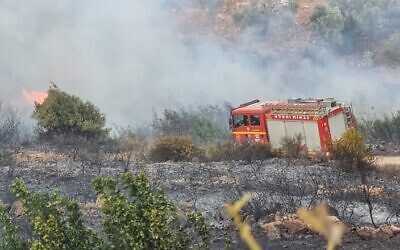 Firefighters work to extinguish a fire near Yarka, November 13, 2021. (Fire and Rescue Services)