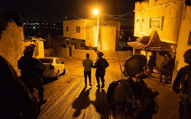 An undated photograph showing Israeli forces arresting a suspect believed to be involved in a major Hamas cell planning terror attacks on Israeli targets in the West Bank and Jerusalem. (Israel Defense Forces) An undated photograph showing Israeli forces arresting a suspect believed to be involved in a major Hamas cell planning terror attacks on Israeli targets in the West Bank and Jerusalem. (Israel Defense Forces)