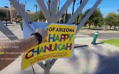 A livestream said to show far-right media personality Tim Gionet vandalizing a Hanukkah menorah in Arizona in 2020. (Screenshot)