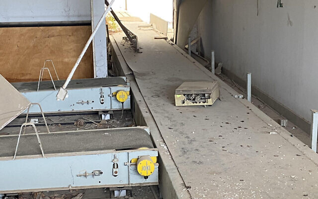 What remains of a baggage conveyer belt inside the terminal at what was once Jerusalem Airport at Atarot, November 2021. (David Horovitz / Times of Israel)