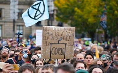 Climate activists march through the streets of Glasgow, Scotland, on November 5, 2021. (AP Photo/Jon Super)