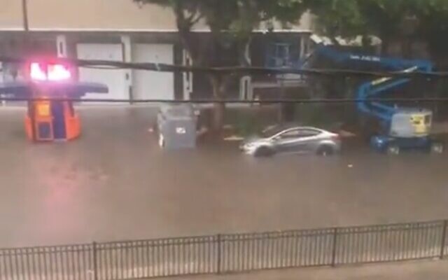 A flooded road in the central coastal city of Netanya on November 20, 2021 (Screen grab/Kan) A flooded road in the central coastal city of Netanya on November 20, 2021 (Screen grab/Kan)