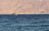 An Israeli Navy vessel is seen opening fire toward a suspious object near the coast of Eilat, on November 6, 2021. (Video screenshot)