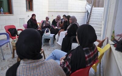 Palestinian female candidates for local council elections prepare campaign merchandise in their village of Burqin, west of Jenin in the West Bank, on December 2, 2021. (Jaafar ASHTIYEH / AFP)