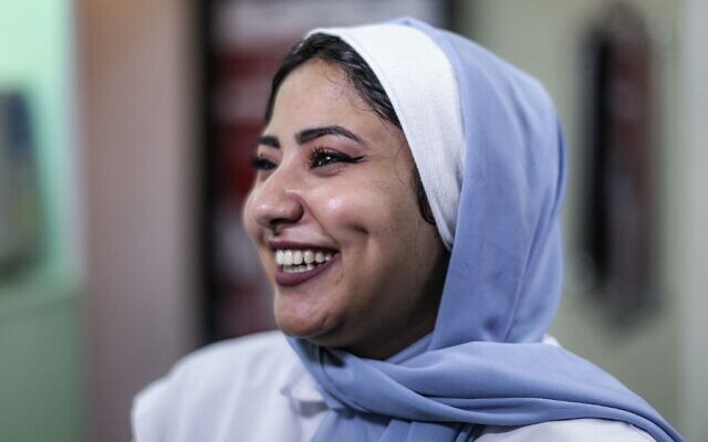 Shoruk Shaheen, a Palestinian woman who has undergone dimple creation surgery, smiles at a clinic in Gaza City on November 30, 2021 (MAHMUD HAMS / AFP) Shoruk Shaheen, a Palestinian woman who has undergone dimple creation surgery, smiles at a clinic in Gaza City on November 30, 2021 (MAHMUD HAMS / AFP)