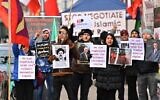 Iranian exiles and supporters of monarchy shout slogans during a demonstration near the Coburg palace during a meeting of the Joint Comprehensive Plan of Action (JCPOA) in Vienna, on December 3, 2021. (Joe Klamar/AFP)