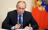 Russian President Vladimir Putin attends a meeting of the Presidential Council for Development of Civil Society and Human Rights via a video link at the Novo-Ogaryovo state residence outside Moscow on December 9, 2021. (Photo by Mikhail Metzel / SPUTNIK / AFP)