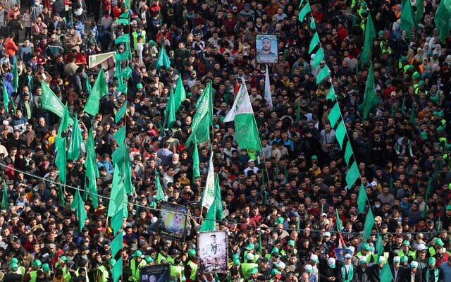 People participate in a rally in the Jabaliya refugee camp in the Gaza Strip, marking the 34th anniversary of the founding of Hamas which rules the coastal enclave, December 10, 2021. (Mohammed ABED / AFP) People participate in a rally in the Jabaliya refugee camp in the Gaza Strip, marking the 34th anniversary of the founding of Hamas which rules the coastal enclave, December 10, 2021. (Mohammed ABED / AFP)