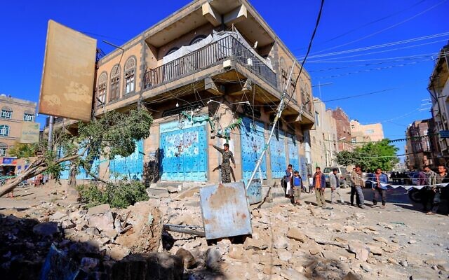 Yemenis inspect damage following a reported overnight air strike by the Saudi-led coalition targeting in the Houthi rebel-held capital Sanaa, on December 24, 2021. (MOHAMMED HUWAIS / AFP) Yemenis inspect damage following a reported overnight air strike by the Saudi-led coalition targeting in the Houthi rebel-held capital Sanaa, on December 24, 2021. (MOHAMMED HUWAIS / AFP)