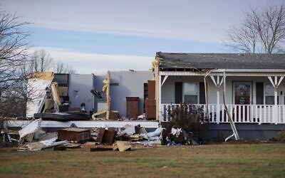 A home damaged by winds stands with some of the walls and roof missing after a tornado ripped through the area the previous evening in Mayfield, Kentucky, on December 11, 2021. (Brett Carlsen / GETTY IMAGES NORTH AMERICA / Getty Images via AFP)