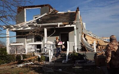 Residents begin the process of salvaging their belongings after a tornado ripped through the area the previous evening on December 11, 2021 in Mayfield, Kentucky. (SCOTT OLSON / GETTY IMAGES NORTH AMERICA / Getty Images via AFP)