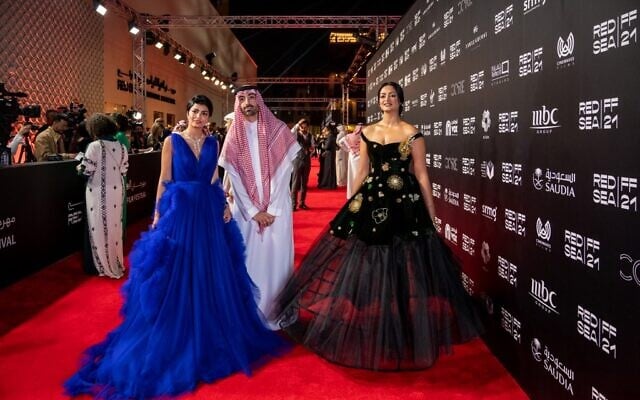 L-R : Saudi actress Mila Al Zahrani and Saudi producer and Chairman of Red Sea Film Festival Mohammed Al Turki and actress Fay Fouad walk the red carpet as they arrive to the opening ceremony of 1st Red Sea Film Festival, in Jeddah, Saudi Arabia, on December 6, 2021. (AMMAR ABD RABBO / Red Sea Film Festival) L-R : Saudi actress Mila Al Zahrani and Saudi producer and Chairman of Red Sea Film Festival Mohammed Al Turki and actress Fay Fouad walk the red carpet as they arrive to the opening ceremony of 1st Red Sea Film Festival, in Jeddah, Saudi Arabia, on December 6, 2021. (AMMAR ABD RABBO / Red Sea Film Festival)
