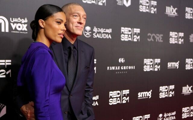 French actor Vincent Cassel and model Tina Kunakey pose on the red carpet of the first edition of the Red Sea Film Festival in the Saudi city of Jeddah, on December 6, 2021. (PATRICK BAZ / Red Sea Film Festival) French actor Vincent Cassel and model Tina Kunakey pose on the red carpet of the first edition of the Red Sea Film Festival in the Saudi city of Jeddah, on December 6, 2021. (PATRICK BAZ / Red Sea Film Festival)