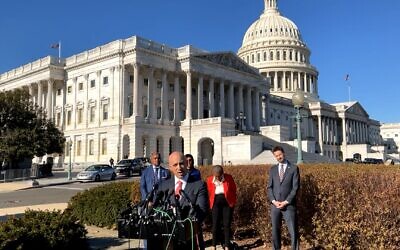 ADL CEO Jonathan Greenblatt, at podium, joining District of Columbia Attorney General Karl Racine, at left, in filing a lawsuit against the groups that allegedly organized the insurrection at the Capitol, speaks at a press conference at the US Capitol, December 14, 2021. (Screenshot/Karl Racine Facebook Watch)