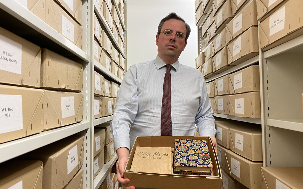 Wiener Holocaust Library director Toby Simpson shows a reporter documents in the central London institution. (Jacob Judah/ JTA)