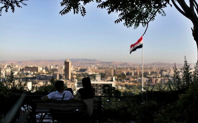 Illustrative: In this July 24, 2019 file photo, a young couple sits in a public garden overlooking the Syrian capital Damascus, Syria. (AP Photo/Hassan Ammar) Illustrative: In this July 24, 2019 file photo, a young couple sits in a public garden overlooking the Syrian capital Damascus, Syria. (AP Photo/Hassan Ammar)
