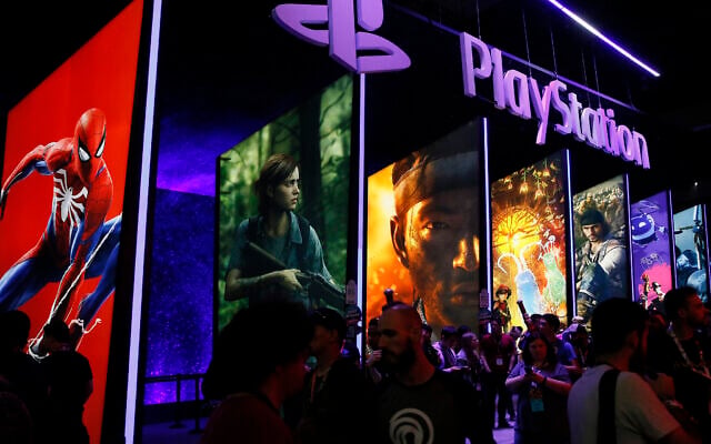 People stand online next to the PlayStation booth at the 24th Electronic Entertainment Expo E3 at the Los Angeles Convention Center on June 14, 2018. Sony said on September 16, 2020, that its upcoming PlayStation 5 video game console would cost $500 and launch November 12. (AP Photo/Damian Dovarganes, File) People stand online next to the PlayStation booth at the 24th Electronic Entertainment Expo E3 at the Los Angeles Convention Center on June 14, 2018. Sony said on September 16, 2020, that its upcoming PlayStation 5 video game console would cost $500 and launch November 12. (AP Photo/Damian Dovarganes, File)