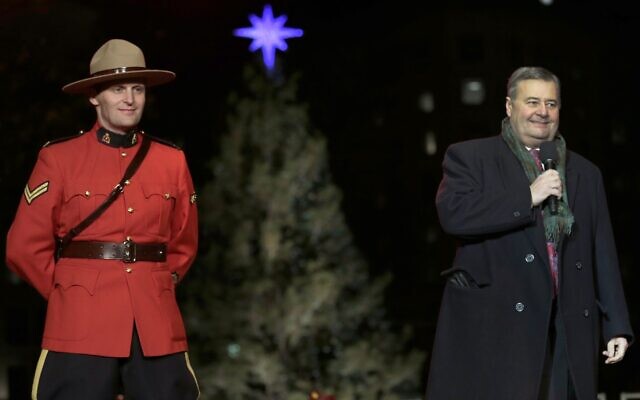 Illustrative: Frank Corbett, the Deputy Premier of Nova Scotia, is flanked by a Royal Canadian Mountie during the lighting of the City of Boston's Christmas tree in Boston, November 29, 2012. The annual gift by Nova Scotia of the tree is in honor of aid that Boston sent following the 1917 explosion of a munitions ship in Halifax harbor that killed more than 1,600. (AP Photo/Charles Krupa)