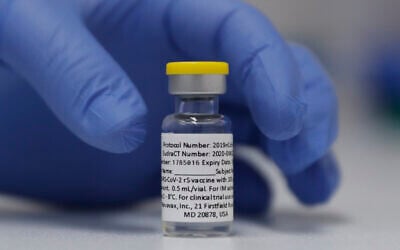 A vial of the Novavax vaccine is seen ready for use in the trial at St. George's University hospital in London, October 7, 2020. (AP Photo/Alastair Grant)