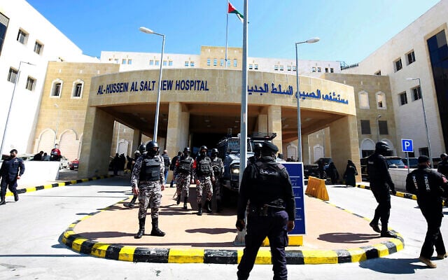 Soldiers stand guard outside Al-Hussein Al Salt Hospital in Salt, Jordan on March 13, 2021 (AP Photo/Raad Adayleh) Soldiers stand guard outside Al-Hussein Al Salt Hospital in Salt, Jordan on March 13, 2021 (AP Photo/Raad Adayleh)