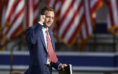 Republican congressional candidate Max Miller pumps his fist before speaking at a rally at the Lorain County Fairgrounds, June 26, 2021, in Wellington, Ohio. (AP Photo/Tony Dejak)