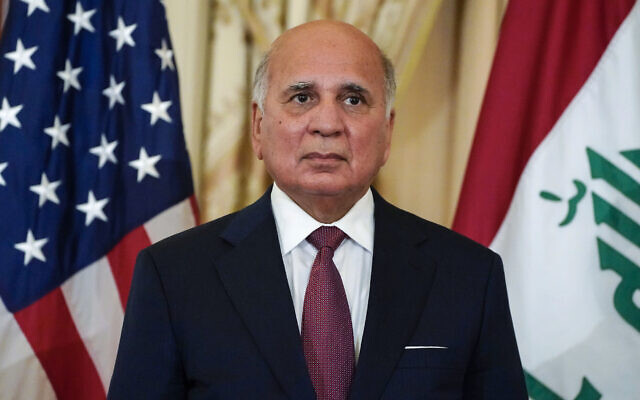 Iraq's Foreign Minister Fuad Hussein listens as he and US Secretary of State Antony Blinken face reporters as they meet at the State Department in Washington, July 23, 2021. (Elizabeth Frantz/Pool via AP) Iraq's Foreign Minister Fuad Hussein listens as he and US Secretary of State Antony Blinken face reporters as they meet at the State Department in Washington, July 23, 2021. (Elizabeth Frantz/Pool via AP)