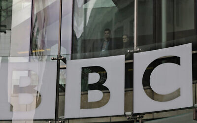 People looks out from inside BBC's New Broadcasting House, in central London, March 28, 2013. (AP Photo/ Lefteris Pitarakis, file)