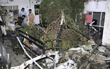 Afghans inspect damage of Ahmadi family house after US drone strike in Kabul, Afghanistan, August 29, 2021. (Khwaja Tawfiq Sediqi/AP)