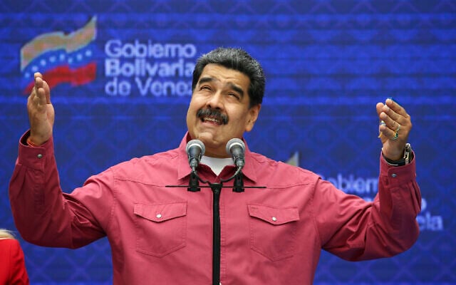 Venezuela's President Nicolas Maduro talks to journalist covering his vote in elections to choose members of the National Assembly in Caracas, Venezuela, Dec. 6, 2020. (Ariana Cubillos/AP) Venezuela's President Nicolas Maduro talks to journalist covering his vote in elections to choose members of the National Assembly in Caracas, Venezuela, Dec. 6, 2020. (Ariana Cubillos/AP)