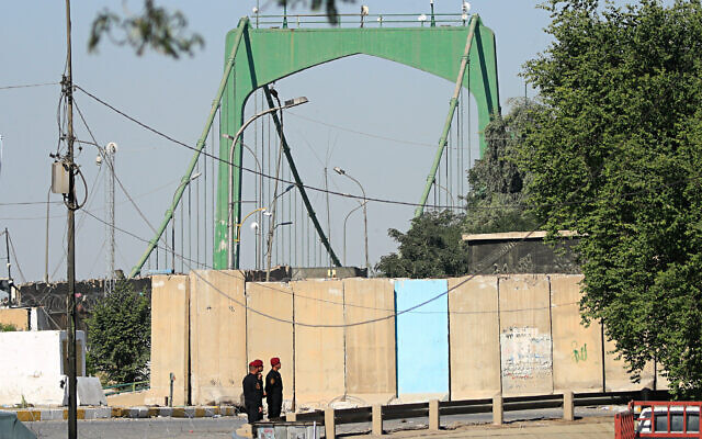 Illustrative: Iraqi Security forces close the heavily fortified Green Zone as they tightened security measures hours after an assassination attempt on Prime Minister Mustafa al-Kadhimi, in Baghdad, Iraq, November 7, 2021. (AP Photo/Hadi Mizban) Illustrative: Iraqi Security forces close the heavily fortified Green Zone as they tightened security measures hours after an assassination attempt on Prime Minister Mustafa al-Kadhimi, in Baghdad, Iraq, November 7, 2021. (AP Photo/Hadi Mizban)
