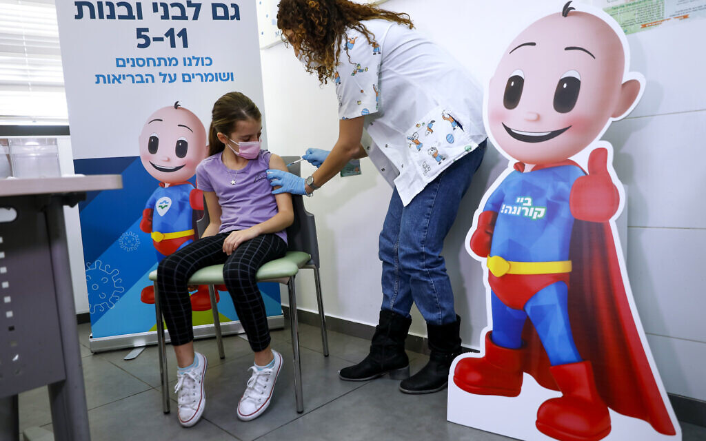 An Israeli girl receives her first Pfizer-BioNTech COVID-19 vaccine from medical staff at Clalit Health services in Tel Aviv, on Tuesday, Nov. 23, 2021. (AP Photo/Oded Balilty) An Israeli girl receives her first Pfizer-BioNTech COVID-19 vaccine from medical staff at Clalit Health services in Tel Aviv, on Tuesday, Nov. 23, 2021. (AP Photo/Oded Balilty)