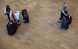 Arrivals at Ben Gurion Airport near Tel Aviv, Israel, Sunday, Nov. 28, 2021. (AP Photo/Ariel Schalit)