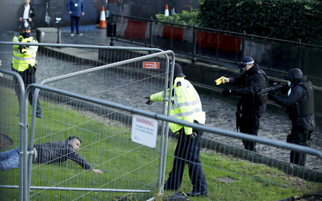 Police officers detain a man after he entered the grounds of the Houses of Parliament in London, Wednesday, Dec. 1, 2021. (AP Photo/David Cliff) Police officers detain a man after he entered the grounds of the Houses of Parliament in London, Wednesday, Dec. 1, 2021. (AP Photo/David Cliff)