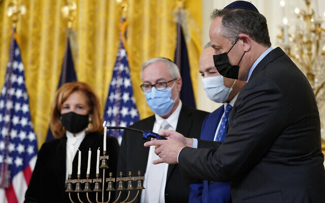 Second gentleman Doug Emhoff, right, lights the menorah in the East Room of the White House in Washington, during an event to celebrate Hanukkah, Wednesday, Dec. 1, 2021. (AP/Susan Walsh) Second gentleman Doug Emhoff, right, lights the menorah in the East Room of the White House in Washington, during an event to celebrate Hanukkah, Wednesday, Dec. 1, 2021. (AP/Susan Walsh)