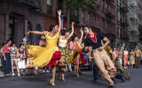 This image released by 20th Century Studios shows Ariana DeBose as Anita, foreground left, and David Alvarez as Bernardo in "West Side Story." (Niko Tavernise/20th Century Studios via AP)