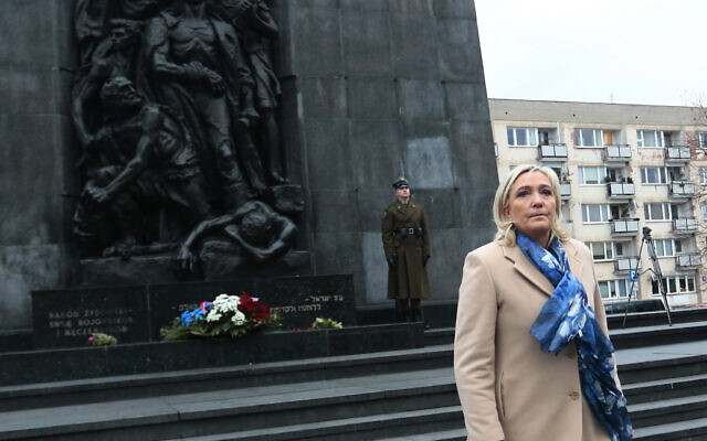 French far-right leader Marine Le Pen pays respects at the memorial to the heroes of the Warsaw Ghetto Uprising, in Warsaw, Poland, on Friday December 3, 2021. (AP Photo/Adam Jankowski) French far-right leader Marine Le Pen pays respects at the memorial to the heroes of the Warsaw Ghetto Uprising, in Warsaw, Poland, on Friday December 3, 2021. (AP Photo/Adam Jankowski)
