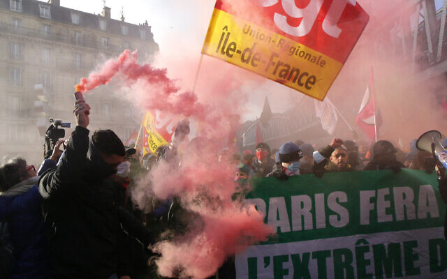 Protesters march behind a banner reading 'Paris will block the far right,' during a demonstration against French presidential candidate Eric Zemmour, on December 5, 2021, in Paris. (AP Photo/Michel Spingler) Protesters march behind a banner reading 'Paris will block the far right,' during a demonstration against French presidential candidate Eric Zemmour, on December 5, 2021, in Paris. (AP Photo/Michel Spingler)