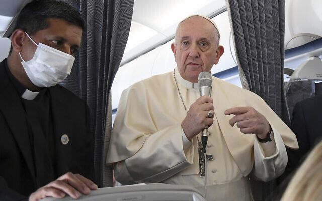 Pope Francis greets the journalists onboard the papal plane on the occasion of his five-day pastoral visit to Cyprus and Greece, Dec. 6, 2021 (Alessandro Di Meo/Pool photo via AP) Pope Francis greets the journalists onboard the papal plane on the occasion of his five-day pastoral visit to Cyprus and Greece, Dec. 6, 2021 (Alessandro Di Meo/Pool photo via AP)
