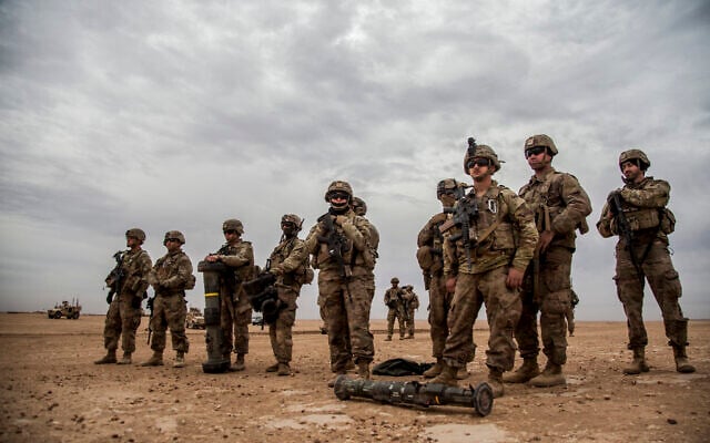Illustrative: American soldiers during an exercise in the countryside of Deir Ezzor in northeastern Syria, December 8, 2021. .(AP/Baderkhan Ahmad) Illustrative: American soldiers during an exercise in the countryside of Deir Ezzor in northeastern Syria, December 8, 2021. .(AP/Baderkhan Ahmad)