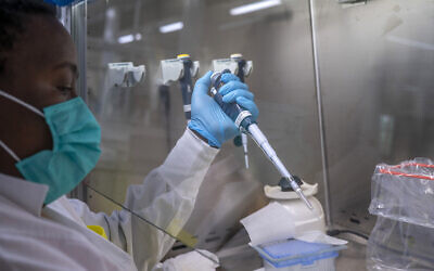 Doctors prepare to sequence COVID-19 Omicron samples at the Ndlovu Research Center in Elandsdoorn, South Africa, on December 8, 2021. (AP Photo/Jerome Delay)