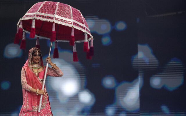 India's Harnaaz Sandhu performs as she takes part in the National Costume portion of the Miss Universe pageant, in Eilat, Israel, Friday, Dec. 10, 2021. (AP Photo/Ariel Schalit)