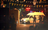 An ambulance enters the Burj Shamali Palestinian refugee camp, in the southern port city of Tyre, Lebanon, Friday, Dec. 10, 2021. (AP Photo/Mohammed Zaatari)