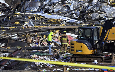 Emergency response workers dig through the rubble of the Mayfield Consumer Products candle factory in Mayfield, Kentucky, Dec. 11, 2021. (Timothy D. Easley/AP)