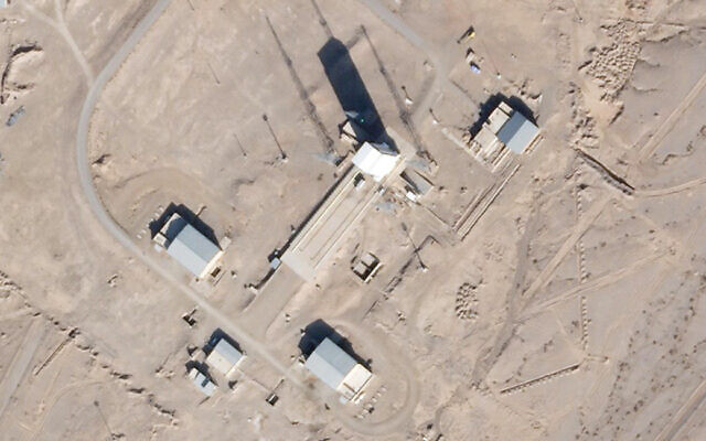 A support vehicle stands parked alongside a massive white gantry that typically houses a rocket on the launch pad as activity is seen at the Imam Khomeini Spaceport in Semnan province, Iran, December 11, 2021. (Satellite photograph by Planet Labs Inc. via AP) A support vehicle stands parked alongside a massive white gantry that typically houses a rocket on the launch pad as activity is seen at the Imam Khomeini Spaceport in Semnan province, Iran, December 11, 2021. (Satellite photograph by Planet Labs Inc. via AP)