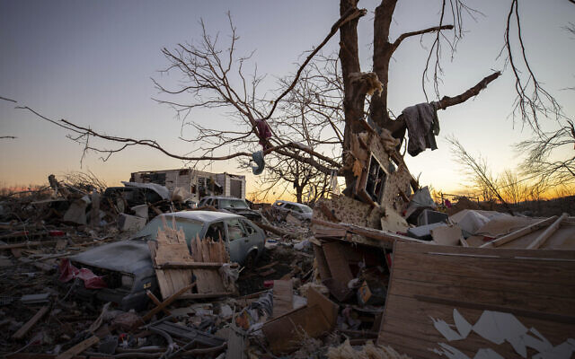 A car sits among the remains of a destroyed house after a tornado in Dawson Springs, Kentucky, December 12, 2021. A monstrous tornado, carving a track that could rival the longest on record, ripped across the middle of the US on December 10. (AP Photo/Michael Clubb) A car sits among the remains of a destroyed house after a tornado in Dawson Springs, Kentucky, December 12, 2021. A monstrous tornado, carving a track that could rival the longest on record, ripped across the middle of the US on December 10. (AP Photo/Michael Clubb)