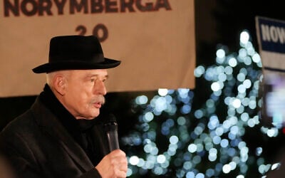 COVID-19 vaccination opponents protest in front of the Polish parliament in Warsaw, Poland, Tuesday, Dec. 14, 2021, against the new restrictions introduced in Poland (AP/Czarek Sokolowski)
