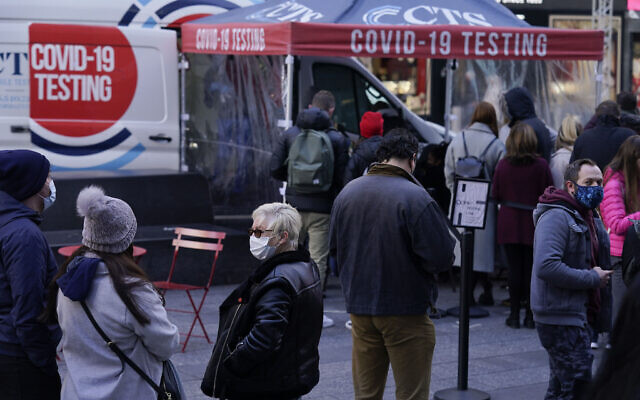People wait in line at a COVID-19 testing site in Times Square, New York, Dec. 13, 2021 (AP Photo/Seth Wenig, File) People wait in line at a COVID-19 testing site in Times Square, New York, Dec. 13, 2021 (AP Photo/Seth Wenig, File)