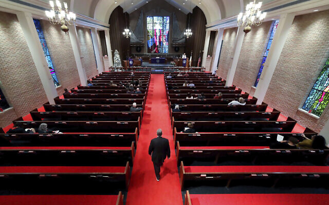 Rev. Meredith Mills delivers a sermon from the pulpit for some 30 attendants during the second service of the day in the sanctuary at Westminster United Methodist Church in Houston, Texas, Dec. 12, 2021. (Michael Wyke/AP) Rev. Meredith Mills delivers a sermon from the pulpit for some 30 attendants during the second service of the day in the sanctuary at Westminster United Methodist Church in Houston, Texas, Dec. 12, 2021. (Michael Wyke/AP)