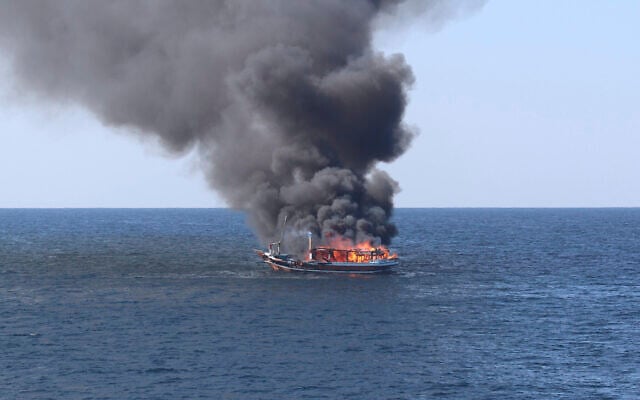 In this handout photograph from the US Navy, a traditional dhow sailing vessel suspected of smuggling drugs burns in the Gulf of Oman on Wednesday, Dec. 15, 2021. (US Navy via AP) In this handout photograph from the US Navy, a traditional dhow sailing vessel suspected of smuggling drugs burns in the Gulf of Oman on Wednesday, Dec. 15, 2021. (US Navy via AP)